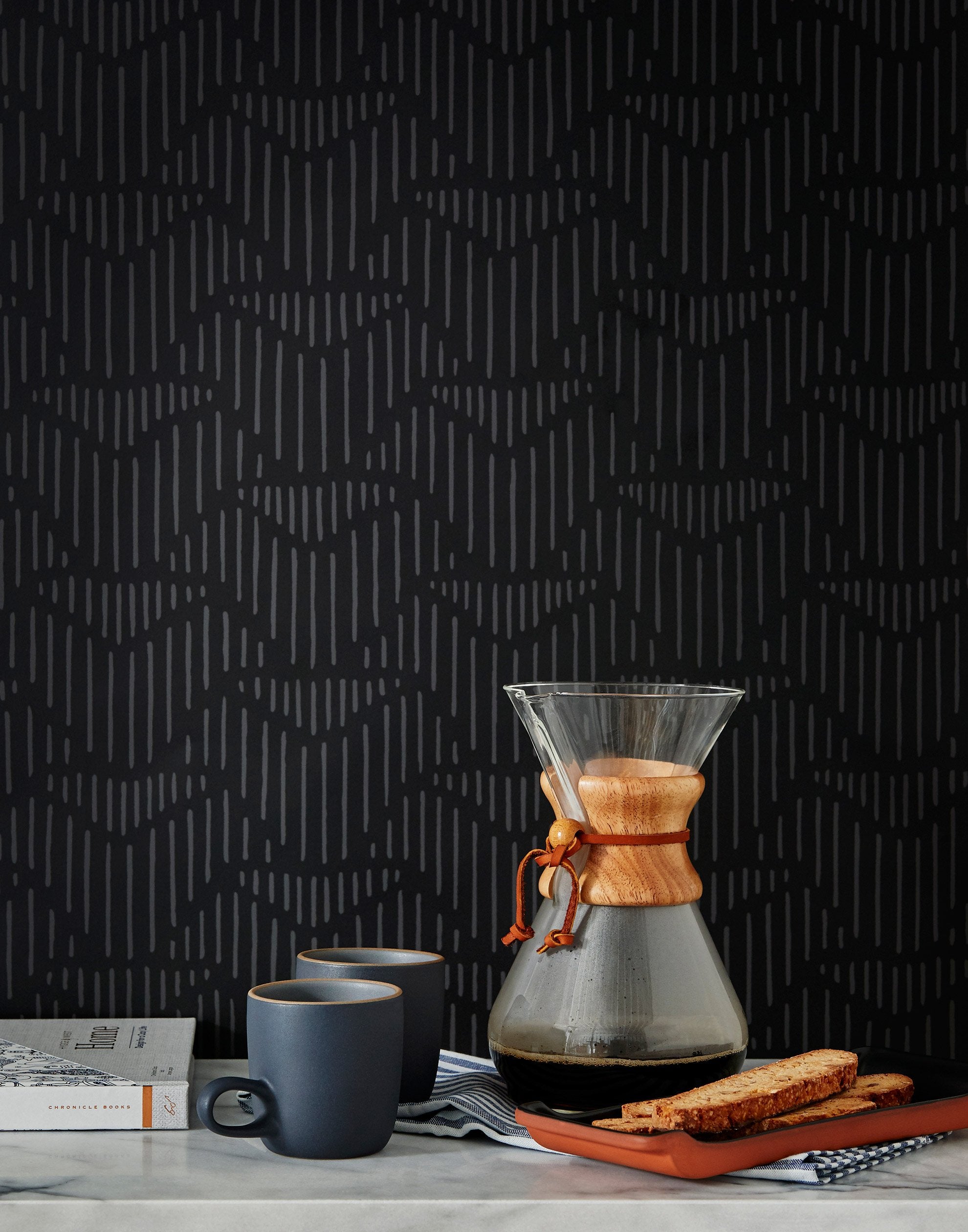 Palma (Ebony) featuring a soft black background with gray geometric pattern