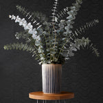 Palma (Ebony) featuring a soft black background with gray geometric pattern