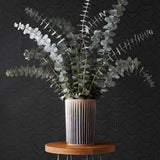 Palma (Ebony) featuring a soft black background with gray geometric pattern
