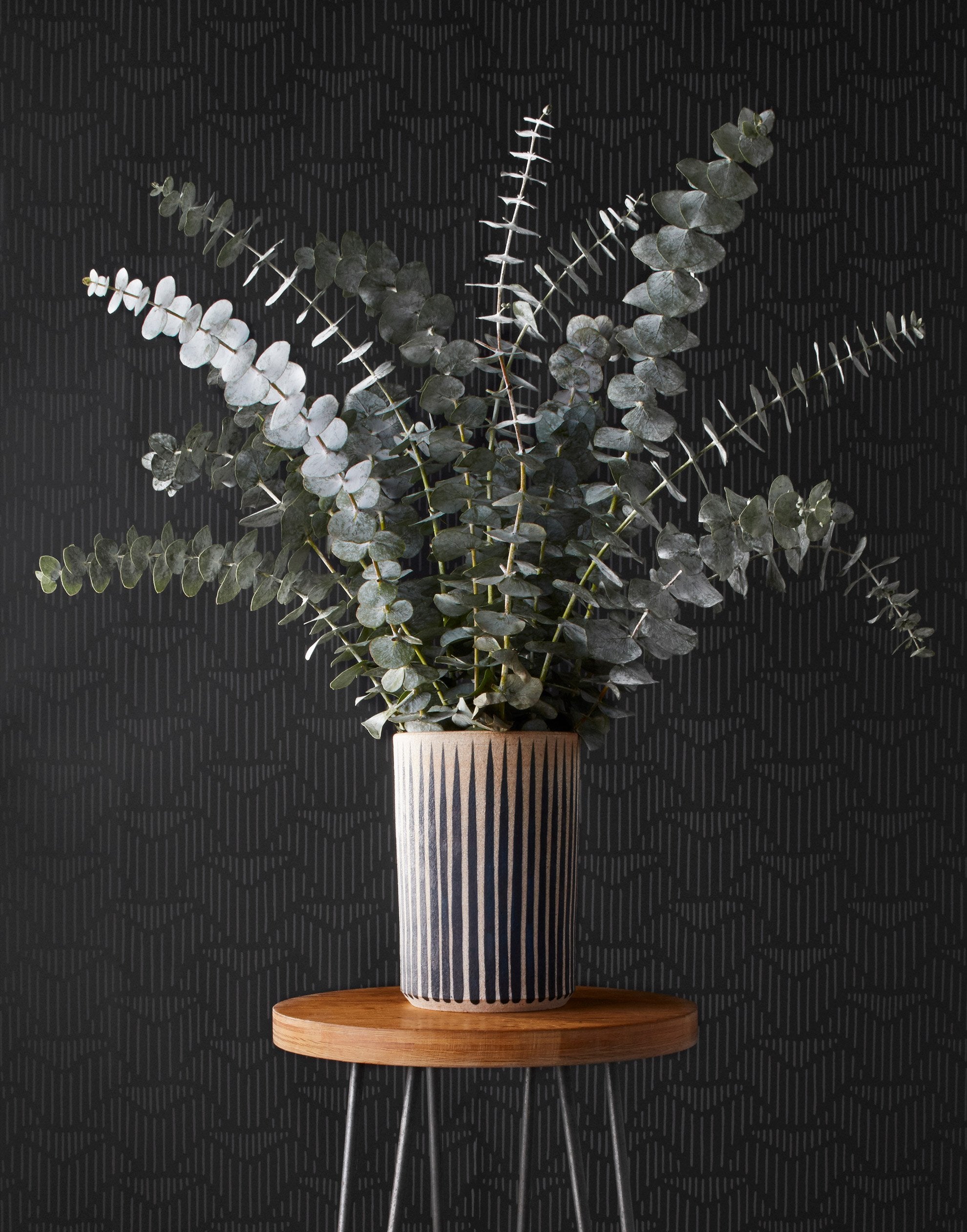 Palma (Ebony) featuring a soft black background with gray geometric pattern