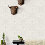 Andanza Taupe wallpaper featuring a delicate pattern created using a stippling technique in taupe gray on white