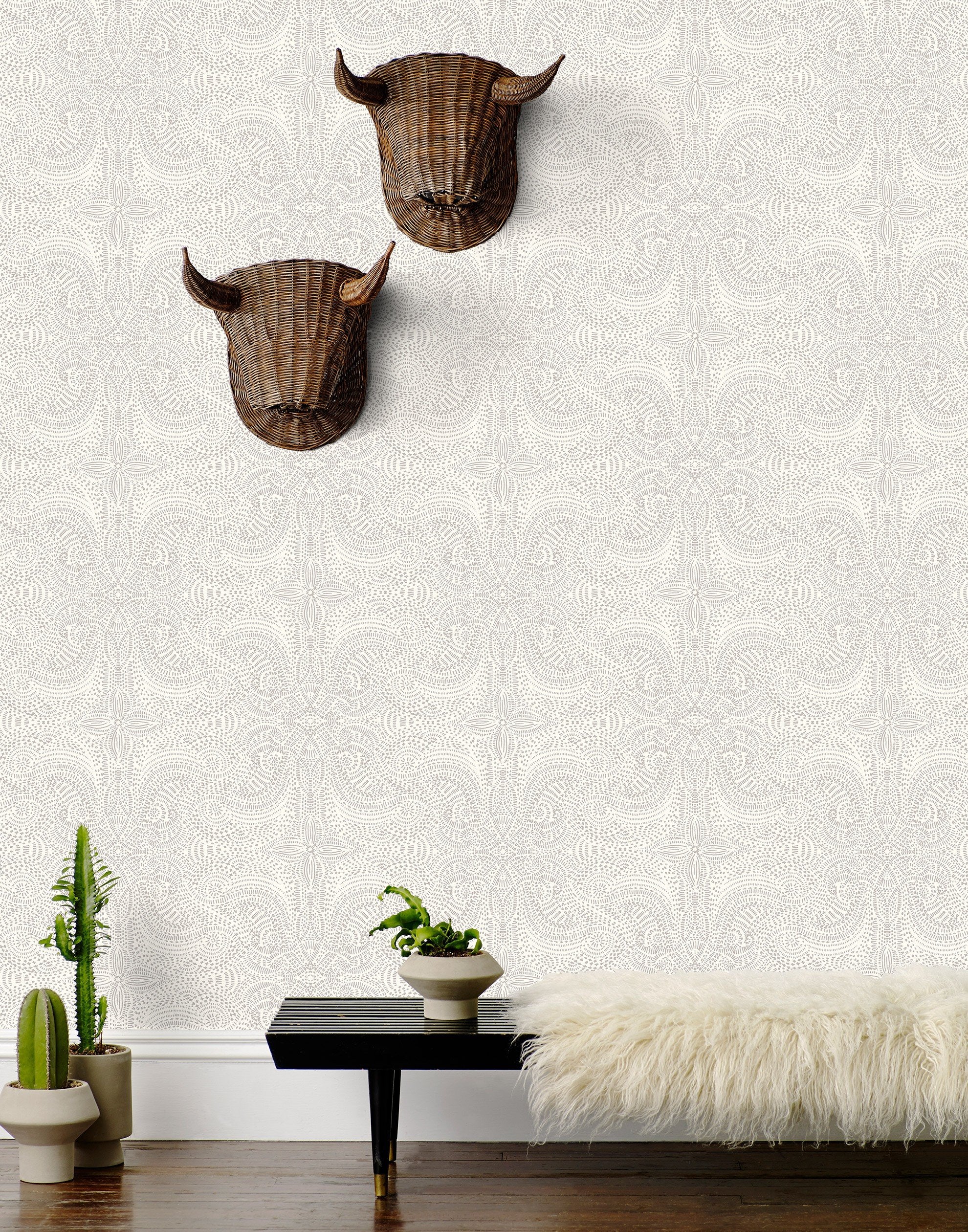 Andanza Taupe wallpaper featuring a delicate pattern created using a stippling technique in taupe gray on white