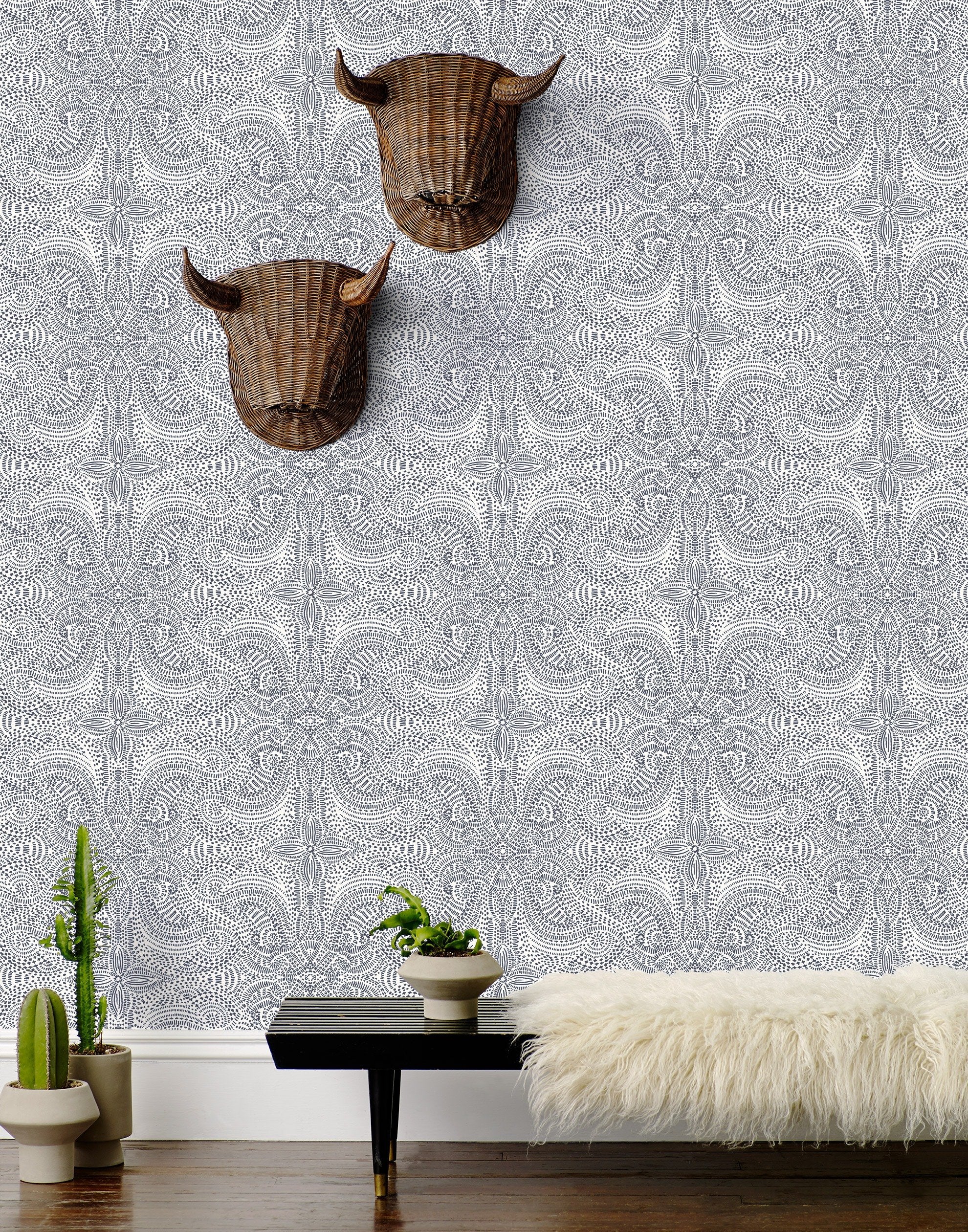 Andanza Navy wallpaper featuring a delicate pattern created using a stippling technique in navy blue on white