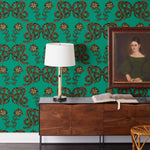Serpentine (Emerald) Wallpaper featuring black and metallic gold snakes and flowers on a green background