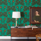 Serpentine (Emerald) Wallpaper featuring black and metallic gold snakes and flowers on a green background