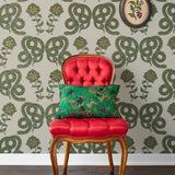 Serpentine (Juniper) Wallpaper featuring deep green and metallic gold snakes and flowers on a soft gray background