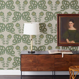Serpentine (Juniper) Wallpaper featuring deep green and metallic gold snakes and flowers on a soft gray background