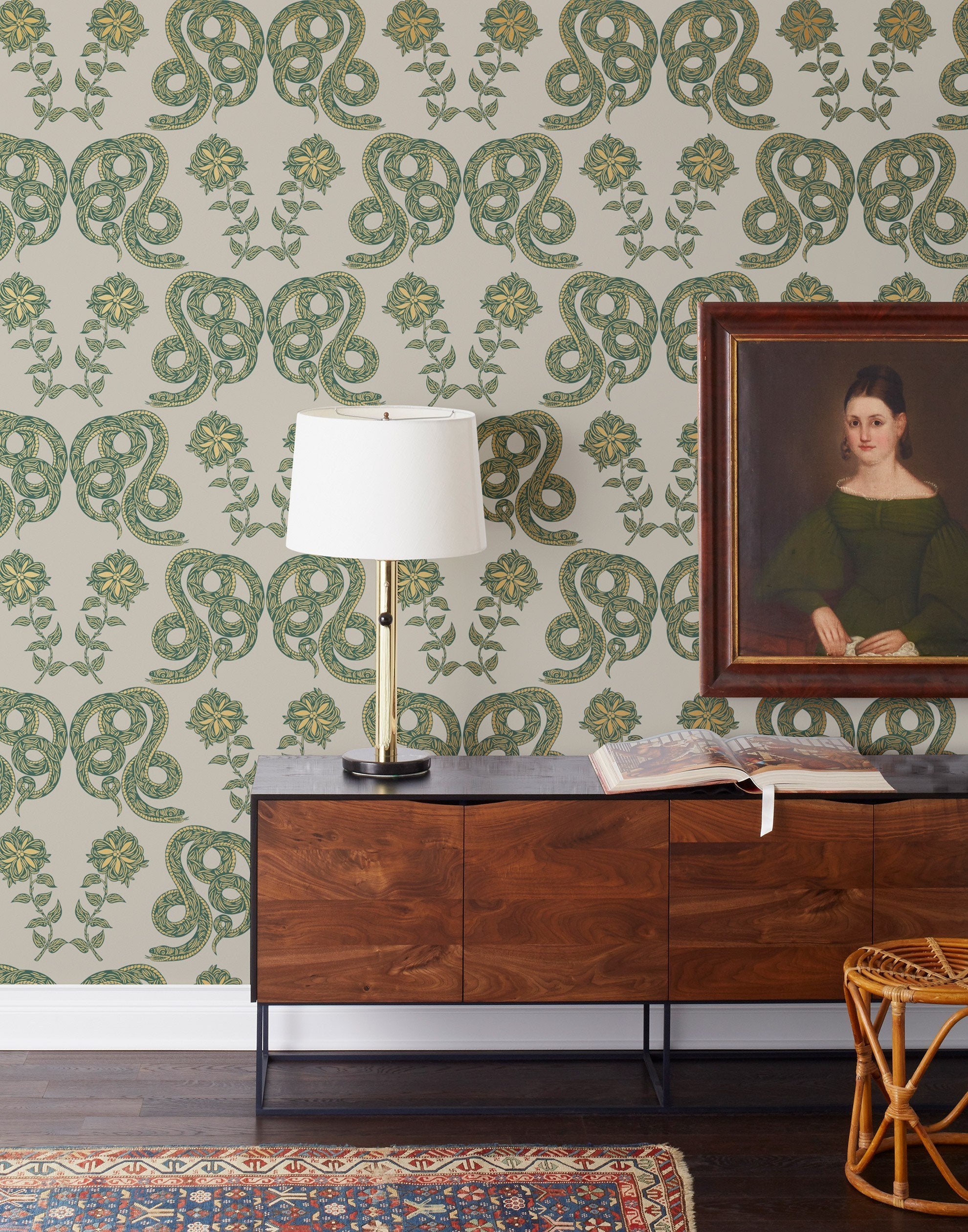 Serpentine (Juniper) Wallpaper featuring deep green and metallic gold snakes and flowers on a soft gray background