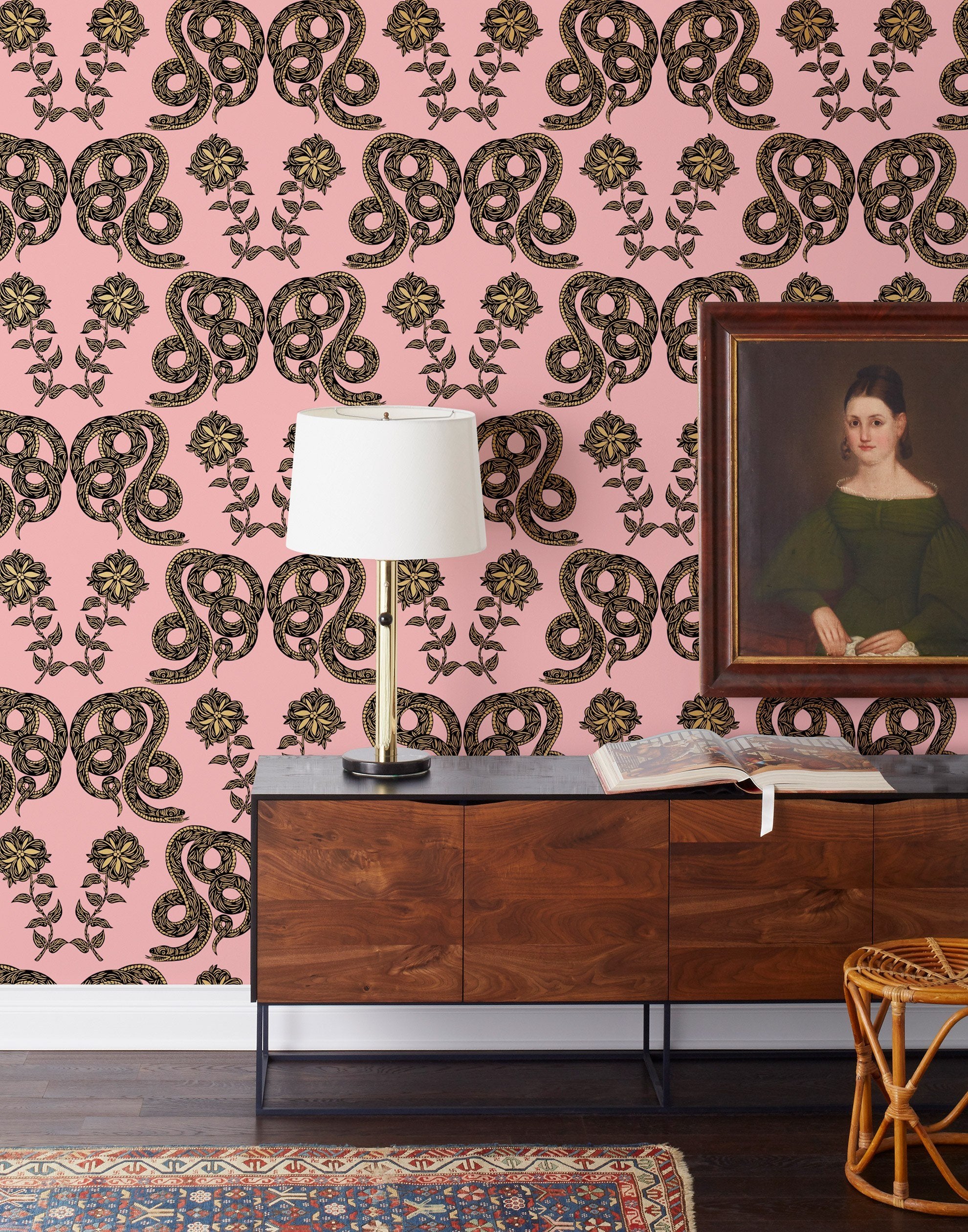 Serpentine (Punch) Wallpaper featuring black and metallic gold snakes and flowers on a punchy pink background