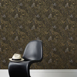 Forest Floor (Ebony) features an intricate, leafy pattern in metallic gold and gray on black