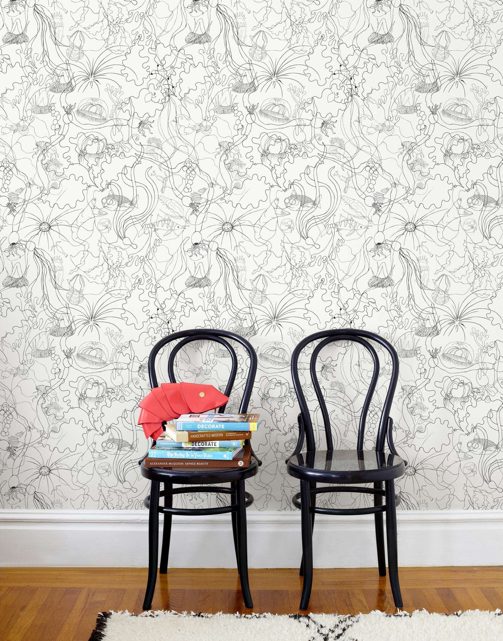 Underwater World (Graphite) features a yet delicate pattern of fish and seaweed in gray on white