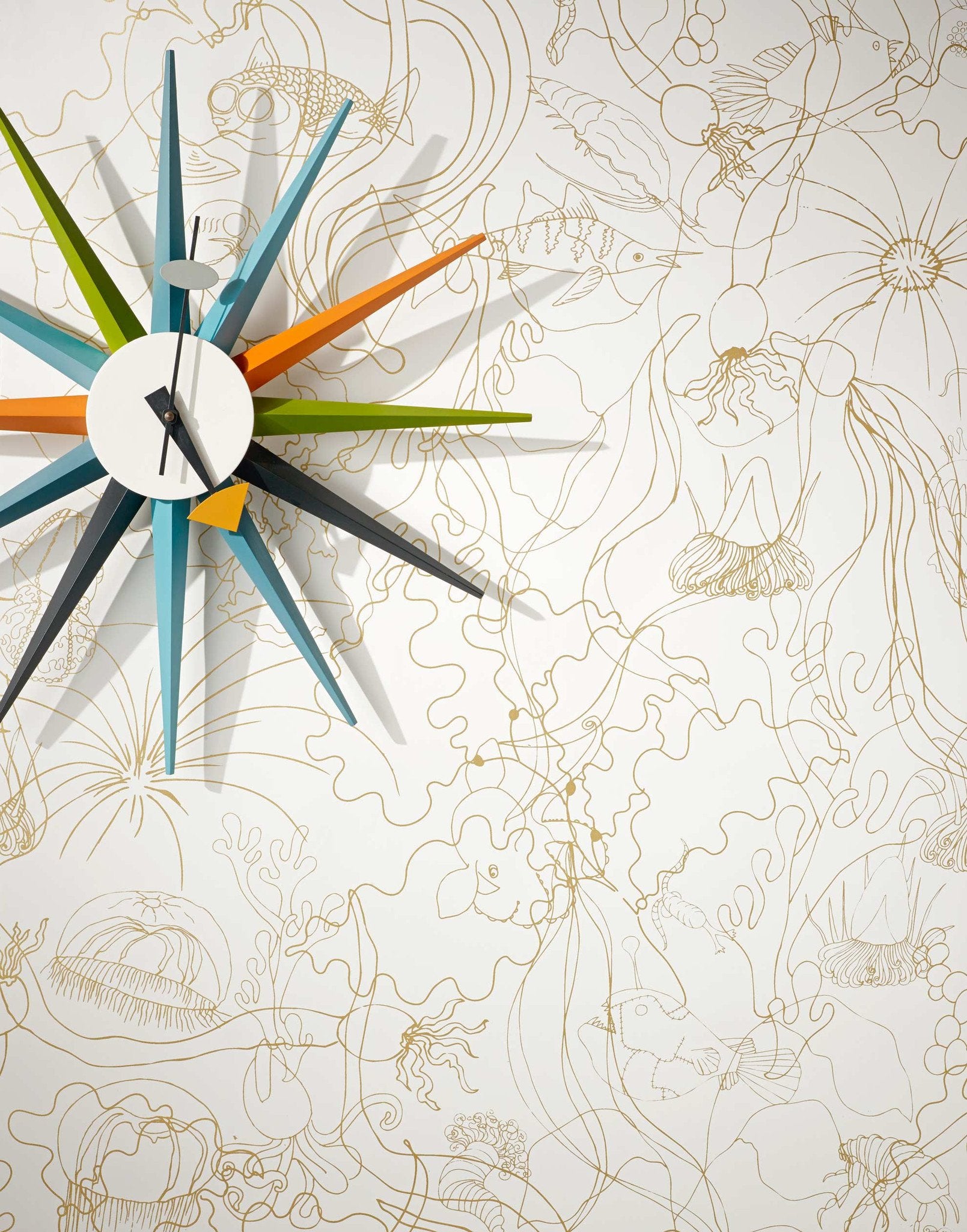 Underwater World (Gold) features a yet delicate pattern of fish and seaweed in metallic on white