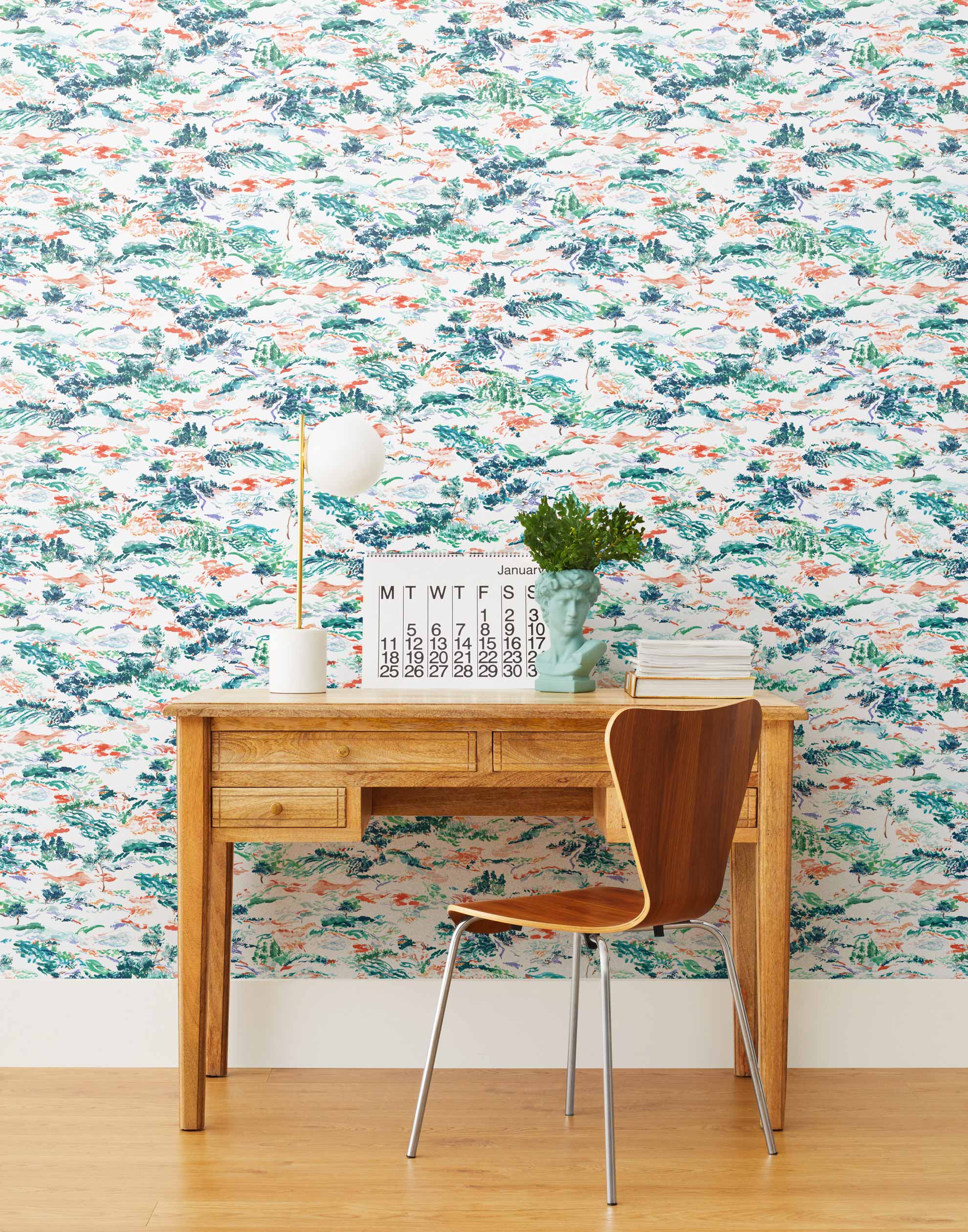 Inspired by the Fauvism movement, Plein Air brings the rolling countryside to life with a gestural brushwork technique. Its colors are joyful and bold while semi-realistic to the subject, including a range of green and blue hues with hints of coral and lavender.