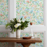 Summer (Vermillion) wallpaper features loose brushstrokes that capture the movement of wild flowers and grasses swaying in the breeze. Coral red, blue and green watercolored flora on a white background | Hygge & West