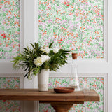 Summer (Poppy) wallpaper features loose brushstrokes that capture the movement of wild flowers and grasses swaying in the breeze. Bright red, lavender purple, and green watercolored flora on a white background | Hygge & West