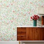 Summer (Poppy) wallpaper features loose brushstrokes that capture the movement of wild flowers and grasses swaying in the breeze. Bright red, lavender purple, and green watercolored flora on a white background | Hygge & West