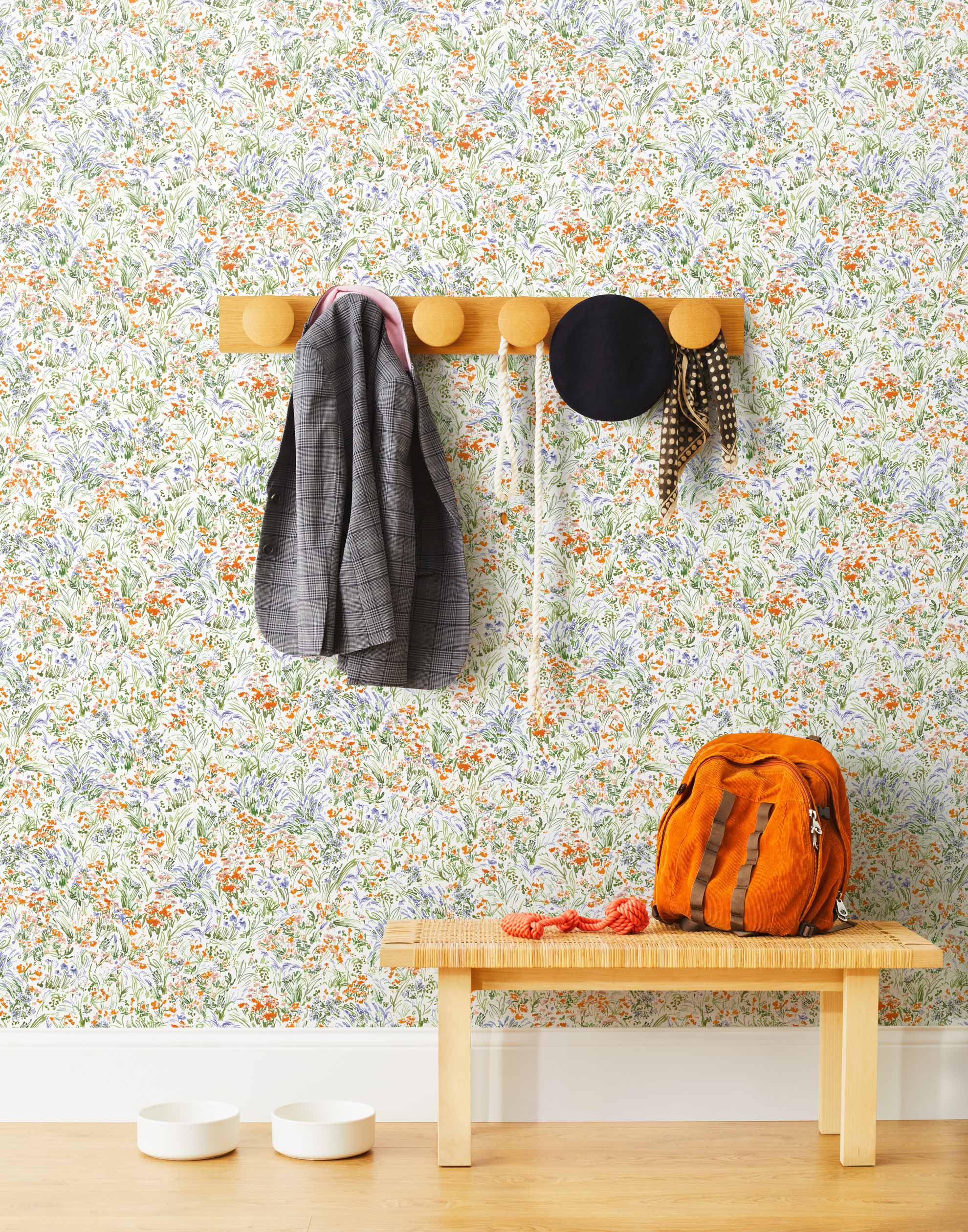 Summer (Bluebell) wallpaper features loose brushstrokes that capture the movement of wild flowers and grasses swaying in the breeze. Orange, blue, purple, and green watercolored flora on a white background | Hygge & West