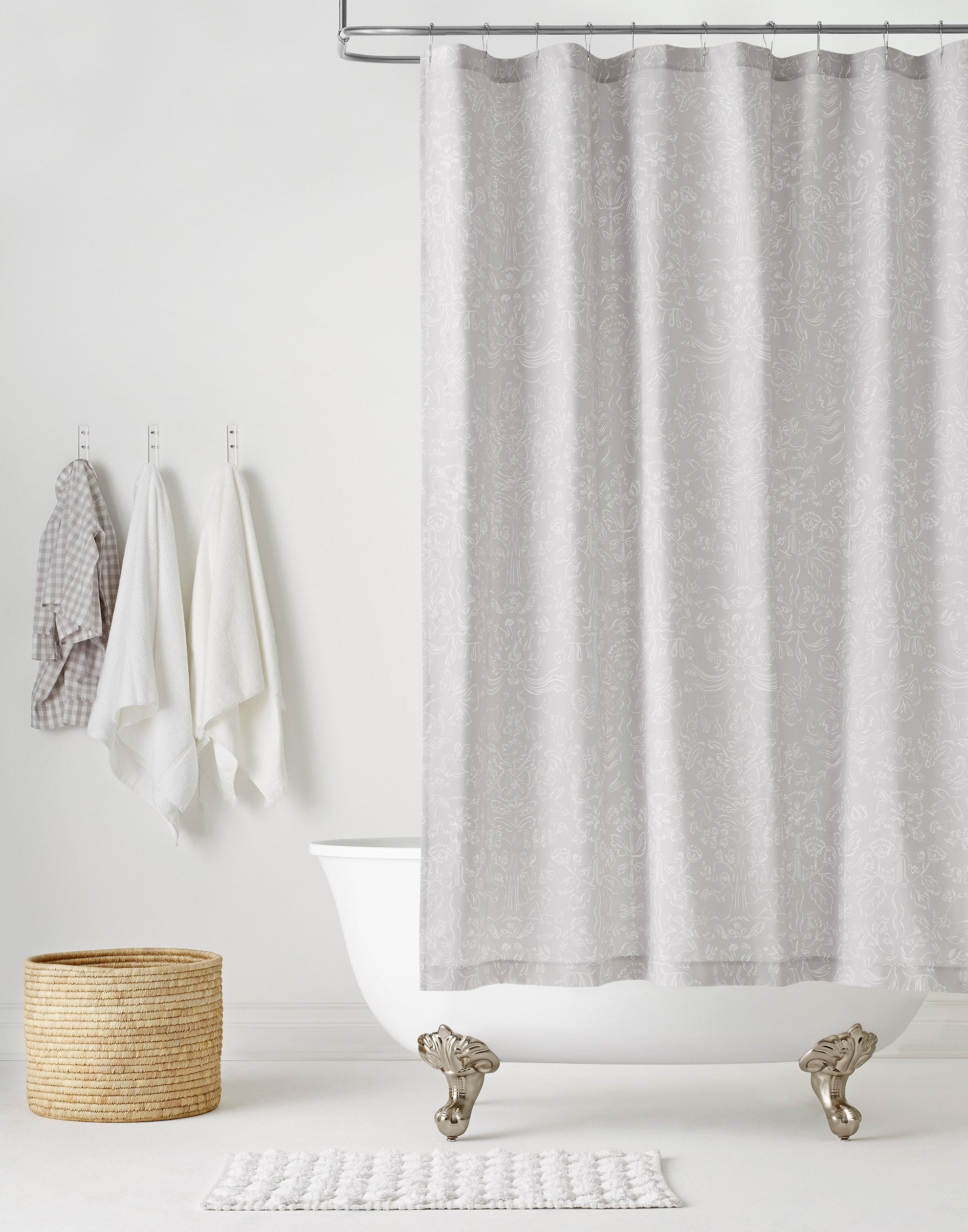 Storyline Gray Shower Curtains featuring white toile-like illustrations on a soft gray background