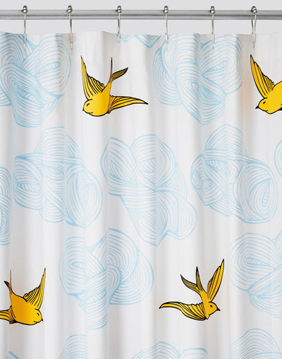Daydream (Sunshine) Shower Curtain features a pattern of flying birds and floating clouds in yellow and blue on white