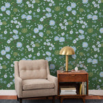 Cascade Meadow (Juniper) featuring hand drawn flowers in light blue and yellow on a green background | Schoolhouse x Hygge & West