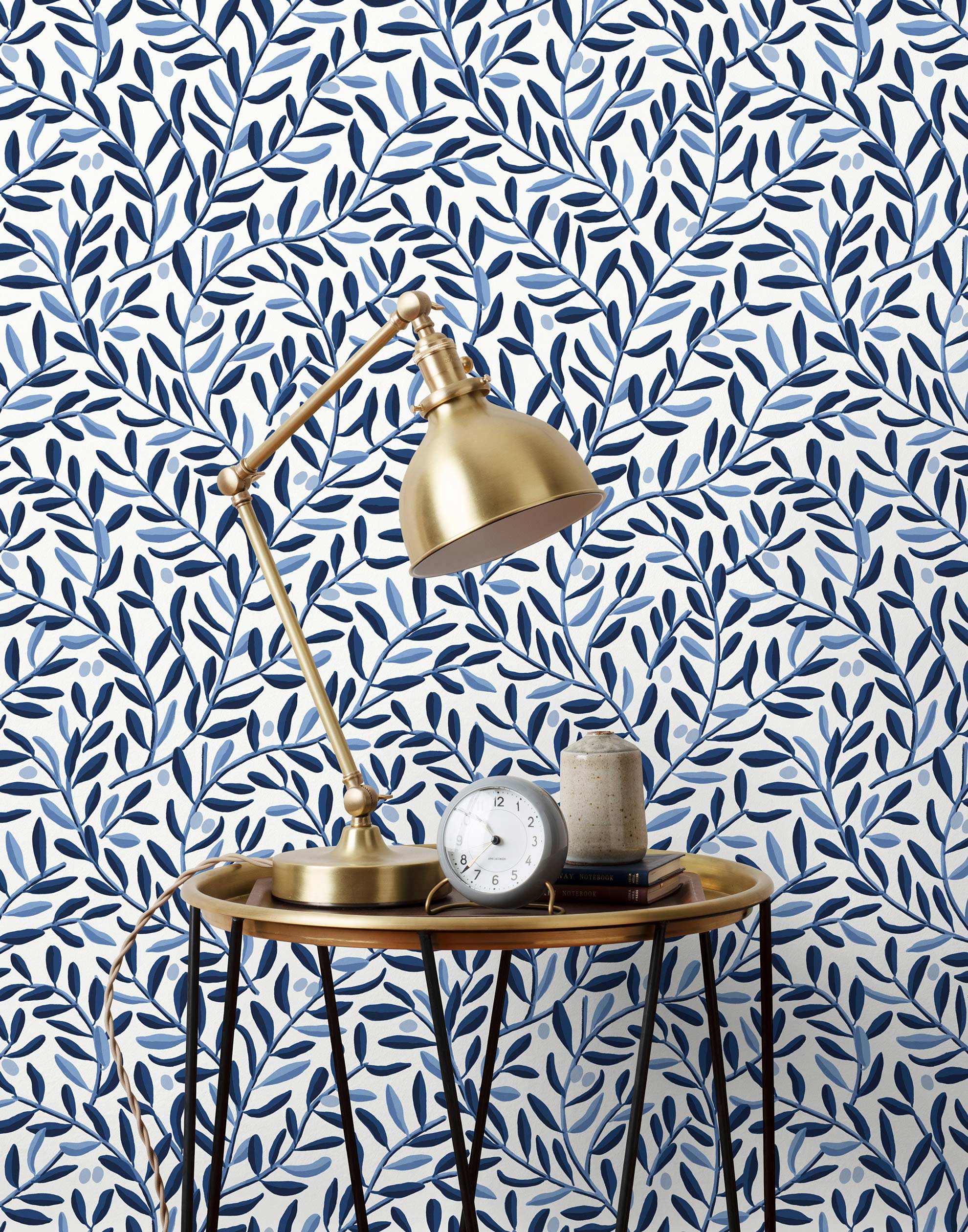 Olive Grove (Blue) featuring a leafy vine motif in shades of blue with light blue accents on a true white background | Schoolhouse x Hygge & West Wallpaper Collection