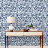 Olive Grove (Blue) featuring a leafy vine motif in shades of blue with light blue accents on a true white background | Schoolhouse x Hygge & West Wallpaper Collection