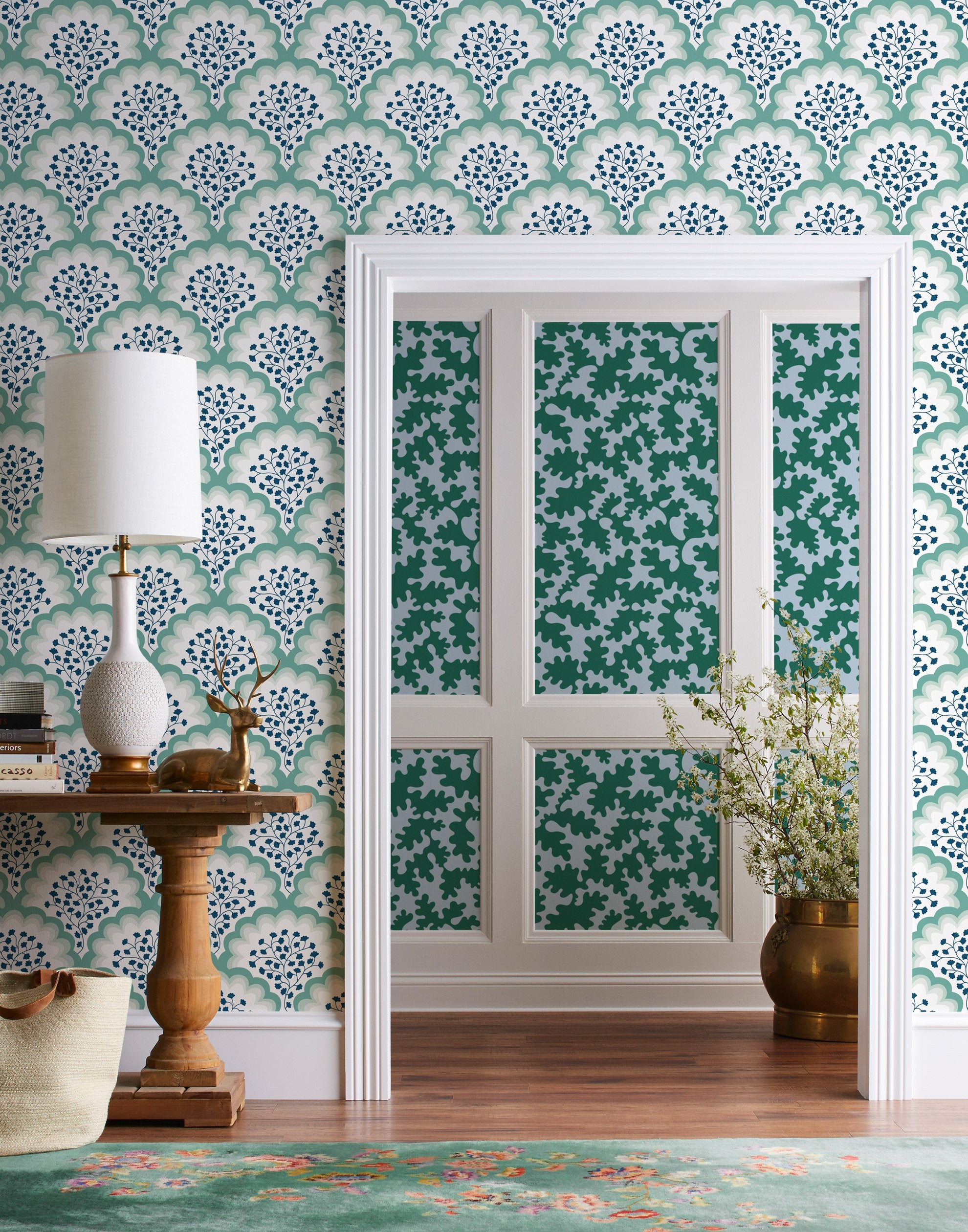 Angelina (Laurel) wallpaper features a White background with graduated green scallops and navy floral motif
