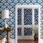 Angelina (Navy) wallpaper features a White background with graduated blue scallops and navy floral motif
