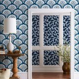Angelina (Navy) wallpaper features a White background with graduated blue scallops and navy floral motif