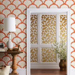 Angelina (Coral) wallpaper features an off white background with graduated coral scallops and gold floral motif
