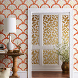 Angelina (Coral) wallpaper features an off white background with graduated coral scallops and gold floral motif