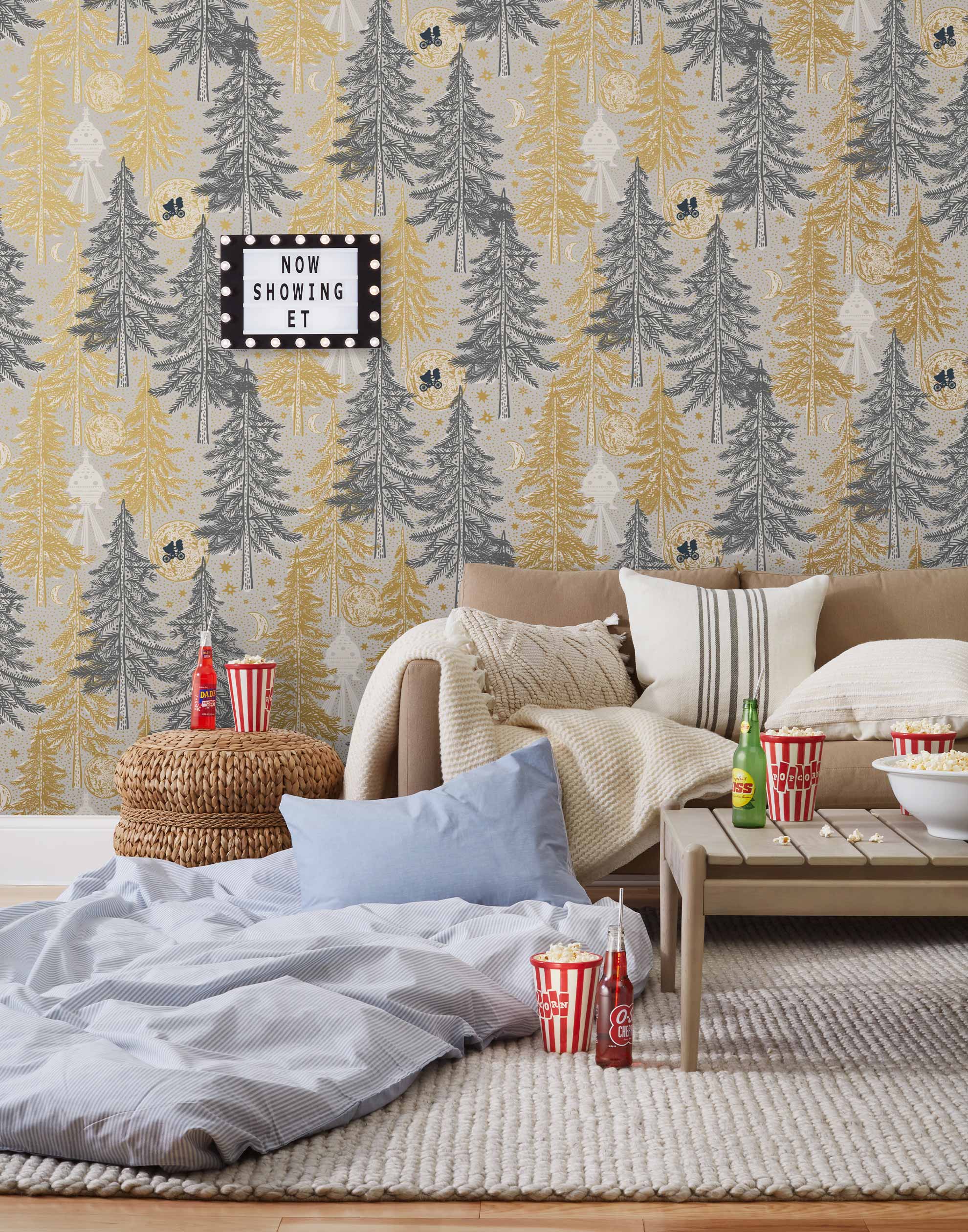 Be Good (Dusk) Wallpaper with gray and gold illustrations on a cream background depicts scenes from the iconic movie E.T. the Extra-Terrestrial and was created in collaboration with Universal | Hygge & West