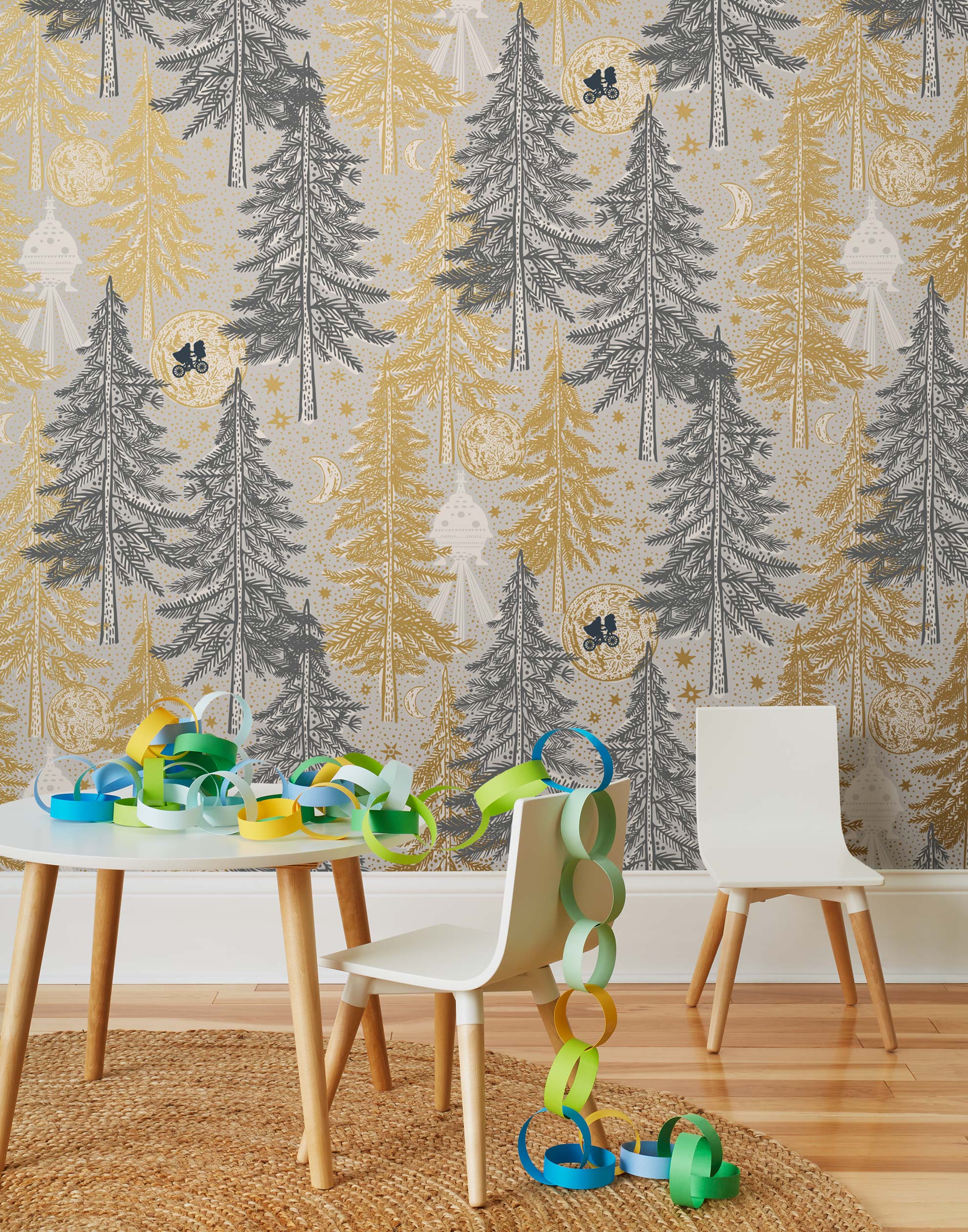 Be Good (Dusk) Wallpaper with gray and gold illustrations on a cream background depicts scenes from the iconic movie E.T. the Extra-Terrestrial and was created in collaboration with Universal | Hygge & West