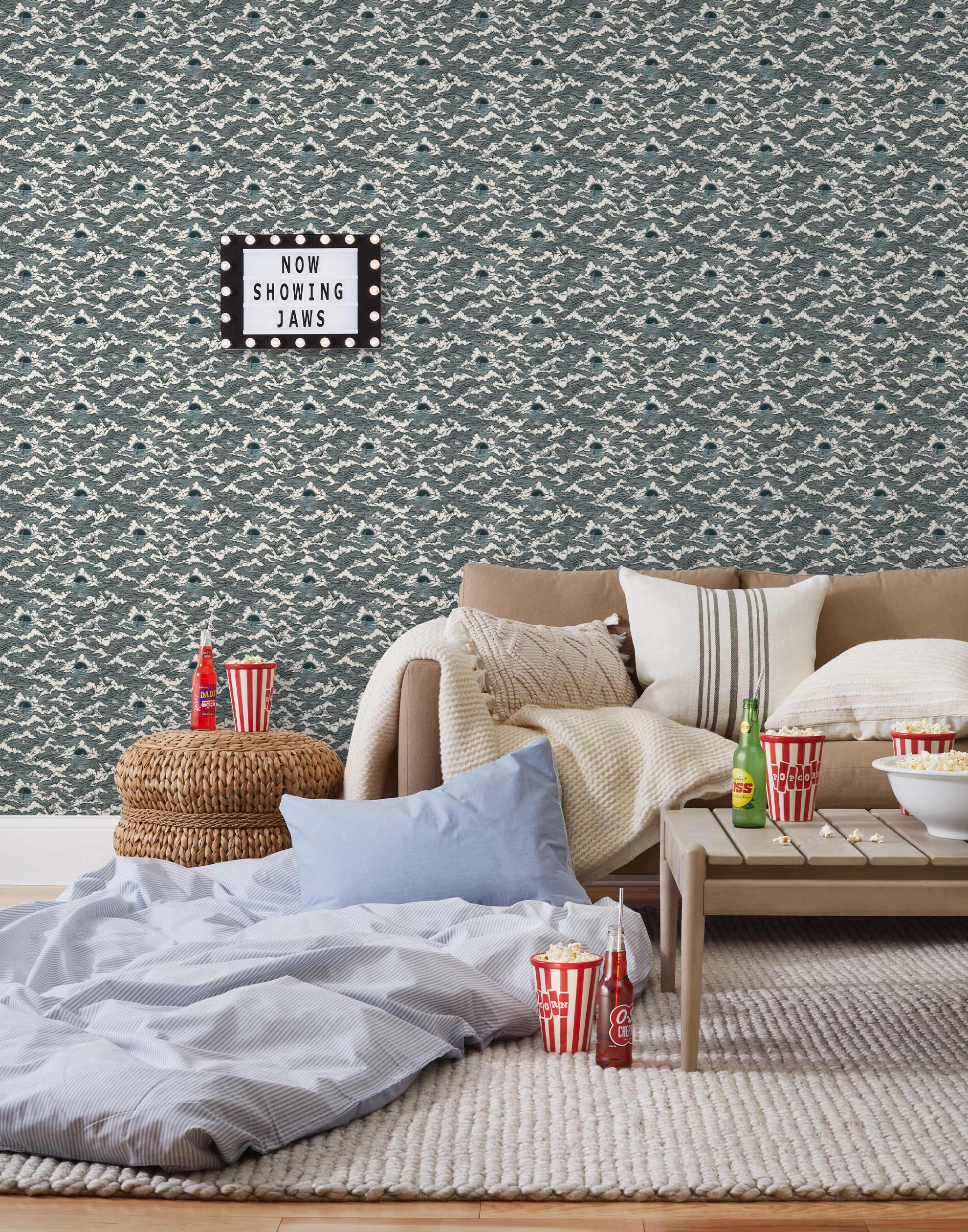 Amity Sunset (Ink) Wallpaper with dark blue and off white illustrations depicts scenes from the iconic movie Jaws and was created in collaboration with Universal | Hygge & West