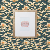 Amity Sunset (Indigo) Wallpaper with navy blue, white, and orange illustrations depicts scenes from the iconic movie Jaws and was created in collaboration with Universal | Hygge & West