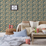 Amity Sunset (Indigo) Wallpaper with navy blue, white, and orange illustrations depicts scenes from the iconic movie Jaws and was created in collaboration with Universal | Hygge & West