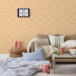 Amity Sunset (Blush) Wallpaper with pink, orange, and white illustrations depicts scenes from the iconic movie Jaws and was created in collaboration with Universal | Hygge & West