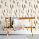 Plumes Natural Wallpaper features delicate feathers in orange, rust, blues and browns on a cream background